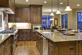 With walnut, despite its great natural color, it is a good idea to use a wiping stain so that its original color will not lighten and wash out. Wood Cabinets And Floor Good Combo Traditional Kitchen Cabinets Kitchen Design Kitchen Remodel