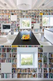 Create rustic home decor with these 2 piece long wall shelves. This Long Wall Of Shelving Incorporates Storage A Fireplace Windows And Seating