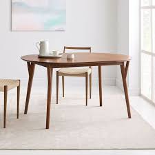 Stylish and sustainable, this wooden dining table set is perfect for an environmentally conscious home. Mid Century Rounded Expandable Dining Table