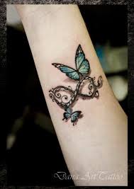 Hhhmmm Something Along These Lines With The Kids Names And Possibly Their Thumbpri Tattoos For Daughters Butterfly Tattoos For Women Butterfly Wrist Tattoo