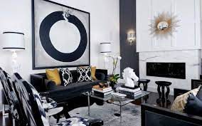 The gold rug, sofa, and pillows give a beautiful touch to this black and white living room. 24 Gold Living Room Ideas That Ll Leave You Awestruck