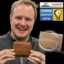 The face of C3 Makerspace 💡 LEARNING SUCCESS! Nice work laser-engraving  your wallet, Mr. Chenoweth! 👏 #TopperUp CHS Professional Development Day:  C3 INTRO with Geauga County Public Library