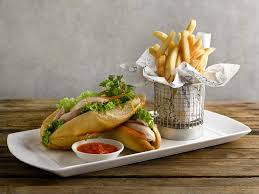 It is a meal of steamed rice which can be plain or mildly flavored, and served with a variety of curries and side dishes. Poached Hainanese Chicken Sandwich Picture Of The Best Brew Singapore Tripadvisor