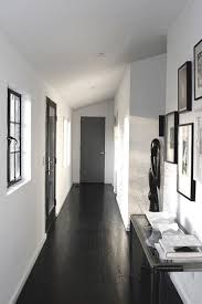 Jeff Madalena Jeff Owns This Home In The Catskills With His Equally Aesthetically Minded Partner Jaso Black Wood Floors Black And White Hallway White Hallway