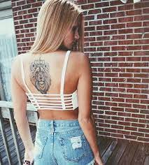 Tattoos On The Back The New Fashion To Wear In The Street Style Fashion Street Style Tattoos Lion Back Tattoo Back Tattoo Lion Tattoos For Women