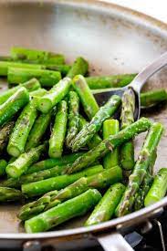 Boil water in a wide frying pan or stock pot, place asparagus in the boiling water and cook for 2 minutes or until bright green. How To Cook Asparagus 6 Easy Methods Jessica Gavin