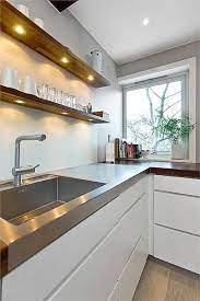 Floating kitchen shelves are a popular alternative when you choose to use your upper enclosed cabinets. Integrated Under Shelf Lighting For Kitchen Wall Shelves On Either Side Of The Fan Kjokkendesign Diy Kjokken Kjokken Innredning