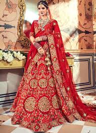 Indian wedding clothes are elaborate set of clothes worn by the bride, bridegroom and other relatives attending the wedding. Red Satin Embroidered Heavy Designer Indian Wedding Lehenga Choli 4708