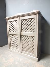 antique pine cupboard with lattice work