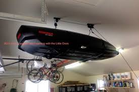 Like, we really, really use our garage. Love Laughter And Learning With The Little Ones Diy Roof Mount Cargo Box Lift Roof Storage Roof Box Diy Overhead Garage Storage