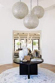 In these instances, using a round entry table with ottomans below or chairs for a reading nook nearby will be the perfect filler. How To Style A Round Entry Table Step By Step Guide 10 Photos