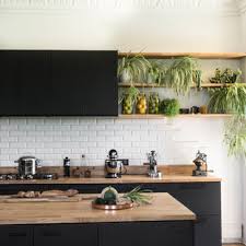 black cabinets and wood countertops