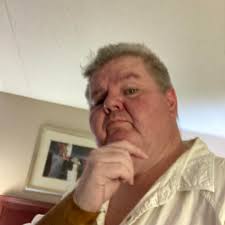 How can I use a motor to make a seesaw move for a haunted playground theme?