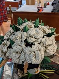 Peonies, lillies, roses, oh my! Bouquet Made Out Of Pages From A Harry Potter Book It Was Made By My Friend The Bride Who Had A Harry Potter Themed Wedding Still In Awe With All The Decorations