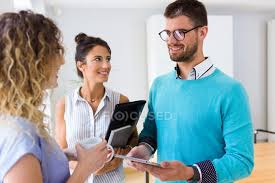 The best selection of royalty free two people talking vector art, graphics and stock illustrations. Smiling Group Of Business People Talking To Each Other In Modern Office Tablet Cheerful Stock Photo 176676872