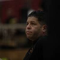 US Navy (USN) Storekeeper First Class (SK1) Michael Simmons, assigned to  the USN Avenger Class Mine Countermeasures Ship, USS PATRIOT (MCM 7),  serves a volleyball as a group of People's Army of