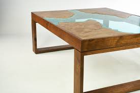 A metal mesh shelf and large casters make this coffee table as practical as it is ruggedly handsome. Pangea I Coffee Table Wayward Grain