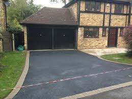 Asphalt driveways are clean, sleek, and highly durable. New Tarmac Driveway With Brick Edging Abbey Paving Block Paving Specialists Wokingham Berkshire
