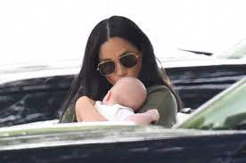 Meghan markle the duchess of sussex seen with baby son archie whilst going to watch prince william and husband prince harry play in the king power royal charity polo day. Meghan Markle Sweetly Kisses Baby Archie During His First Public Outing Hello