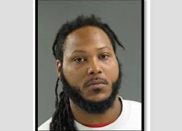 Man charged with 2 murders arrested after brief standoff with cops,  authorities say