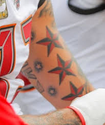 The tattoo contains the super bowl lv logo, the buccaneers' logo, and the numbers 31 and 9 (to represent the final score of the game) embedded on either side of tampa bay. this content is not. Mike Evans 17 Tattoos Their Meanings Body Art Guru