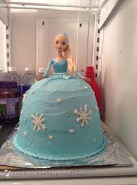 Chocolate birthday cake with golden happy birthday sign. Beautiful Elsa Doll Cake