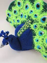 This peacock designed by the talented amanda berry from fluff and fuzz is an ideal gift for kids. Peacock Tea Cosy Knitting Pattern Tea Cosy Knitting Pattern Knitted Tea Cosies Tea Cozy