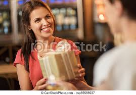 These hilarious ideas will ensure your funny gifts for her stand out. Woman Receiving Present From Friend At Restaurant People Celebration And Greeting Concept Happy Middle Aged Woman Canstock