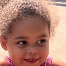 This is a photo of Jamal Zook “Samuel” Cooke (Freddie's nephew) in his home  with a picture of Freddie in the background. He said “Growing up it all  felt quite normal because
