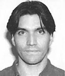 Adaptive extremum seeking control of nonlinear dynamic systems with  parametric uncertainties