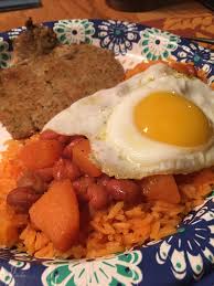 This dish is one of two kinds of puerto rican rice and beans.it goes way back,generation after generation.very cheap and pretty easy just looks hard with all the ingredients!this is a delicious pallet for anyone that wants a taste of the puerto rican culture. Puerto Rican Pork Chop Rice And Beans With A Sunny Side Egg Putaneggonit