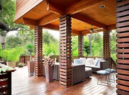 An ipe wood deck and lush plantings soften the property's urban, industrial setting look behind this covered deck for this virginia home's cantilevered roofs, which lift and extend in contrast to the deck's flat roof. 24 Covered Deck Design Ideas
