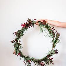 Creating a simple modern wreath is easy using a metal hoop and silk flowers. 17 Modern Christmas Decor Ideas