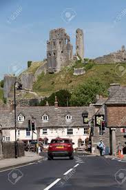 The greyhound inn in corfe, dorset, is a pub that's in tune with a simpler age. Corfe Castle Overlooks The Old Greyhound Pub On The Market Square Stock Photo Picture And Royalty Free Image Image 81330913