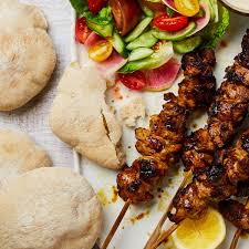 Step 2 slice the pittas in half, stuff with the coleslaw, then slide the chicken from the skewers and add to the pittas. Pitta Patter Yotam Ottolenghi S Recipes For Homemade Pitta With Chicken Skewers Or Herb Fritters Food The Guardian