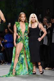 The sheer fabric was printed with a tropical leaf and bamboo pattern, and cut with a very low neckline that extended well past lopez's. Jennifer Lopez Reminisces On Iconic Versace Dress 20 Years Later