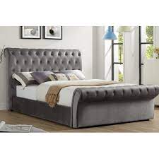 The soft detail of the upholstered head and foot board, contrasts with the sleek black upholstered head and footboard. Canora Grey Suki Upholstered Ottoman Bed Bed Frame With Storage Upholstered Beds Bed Frame