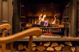 Gas and wood will provide more heat to a house, and require extra safety precautions. Fireplace In Basement Common Issues And Best Basement Fireplace Options