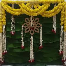 This Cute Backdrop For Puja Is So Simple Nd Elegant Pujadecor Traditional Flowers Housewarming Decorations Indian Floral Decor Wedding Stage Decorations
