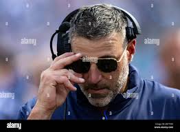 Tennessee head coach Mike Vrabel adjust his sunglasses as he walks the  sideline during their NFL football game against Cincinnati Sunday, Oct. 1,  2023, in Nashville, Tenn. (AP Photo/Wade Payne Stock Photo -