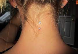 Play, fiddle with or remove the jewelry. Pin By Bridget Haldeman On Diamonds Ink 3 Neck Piercing Dermal Piercing Dermal Piercing Ideas