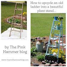 The wood pallets are polished well and then they are shaded in a classy grey color. How To Turn An Old Ladder Into A Beautiful Plant Stand Simple Garden Diy The Pink Hammer Blog