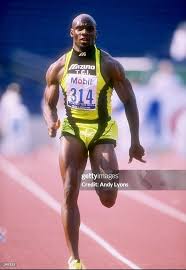 Dennis Mitchell competes in the 100 meter race at the U.S. ...