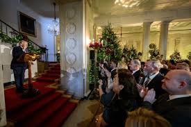 President Donald Trump delivers remarks to staff during a Christmas  Reception – The White House