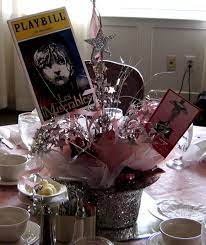 Centerpieces In Top Hats Who Doesn T Love Plays These Top Hats Are An Inexpensive Centerpiece Broadway Theme Party Music Party Decorations Broadway Theme