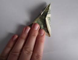 Easy diy instructions which show step by step how to fold a xmas star out of money. Christmas Origami Using Money Lovetoknow
