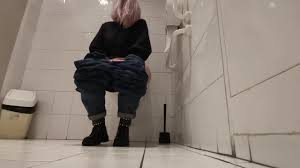 Blonde girl farting on public toilet - ThisVid.com