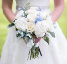 A monochrome or single bloom arrangement of white tulips, poppies or anemones can create a minimalistic, modern bouquet. Bride S Bouquet Creamy Vendela Roses Blush Off White Peonies Seeded Eucalyptus Dusty Mille Blue Wedding Flowers Bridal Bouquet Blue Blue Delphinium Bouquet