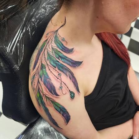 Super fun freehand feathers from today! Covering a couple scars, even! #freehandtattoo #feathertattoo