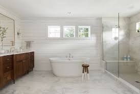 Shiplap Bathroom Clean Lined Bathroom With Shiplap Paneling And White Marble Flooring And Shower Ti White Marble Floor Shiplap Bathroom White Bathroom Designs